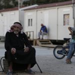 Refugees and migrants at the hospitality center of Elaionas in Athens